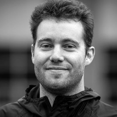 A black-and-white photo of a man.