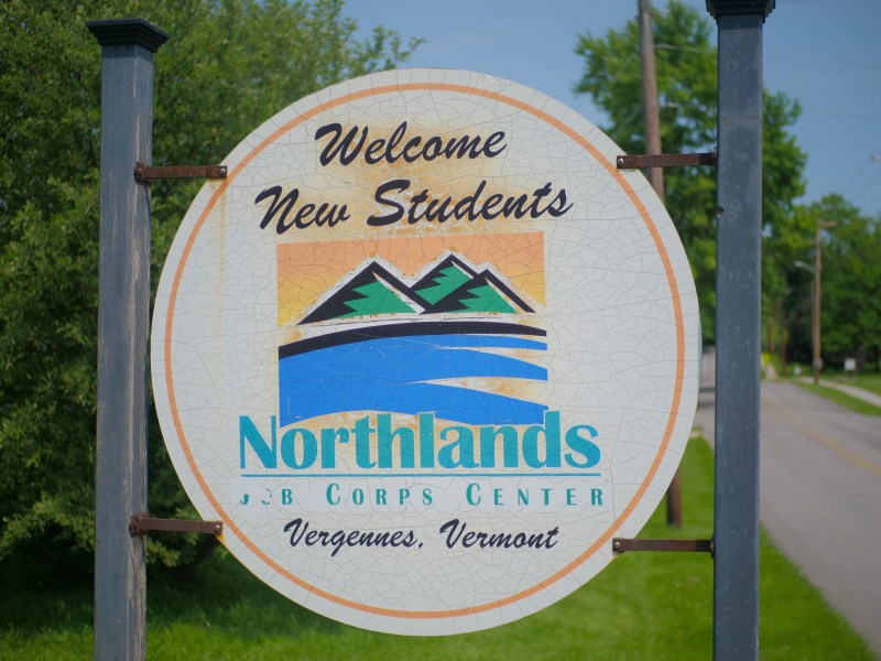 A round sign reads "Welcome New Students, Northlands J.B. Corps Center, Vergennes, Vermont" with a graphic of mountains and a river.