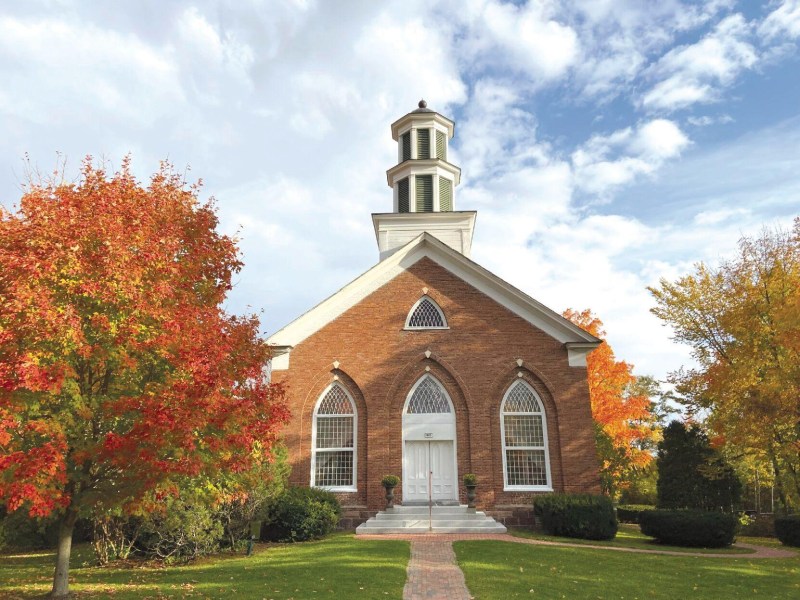 A brick building with a steeple.